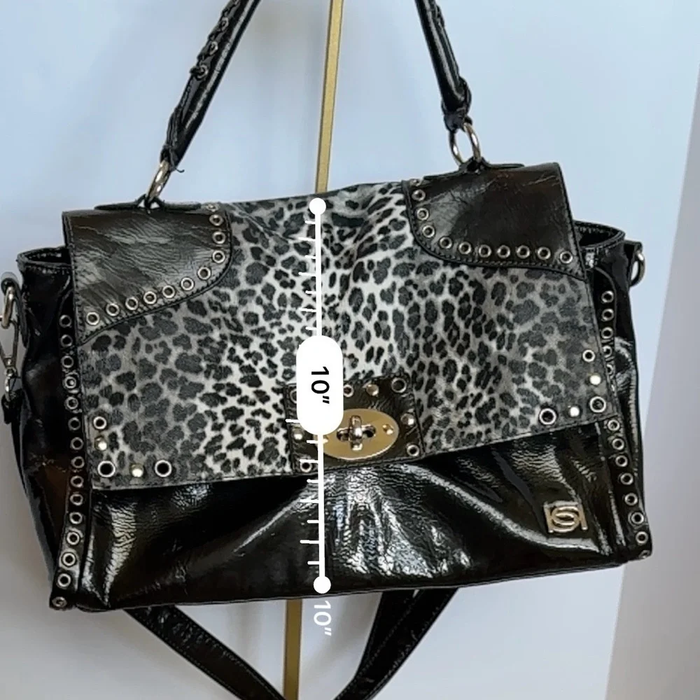 BEBE Large Handbag Leopard Grommet in Black and gray and gold